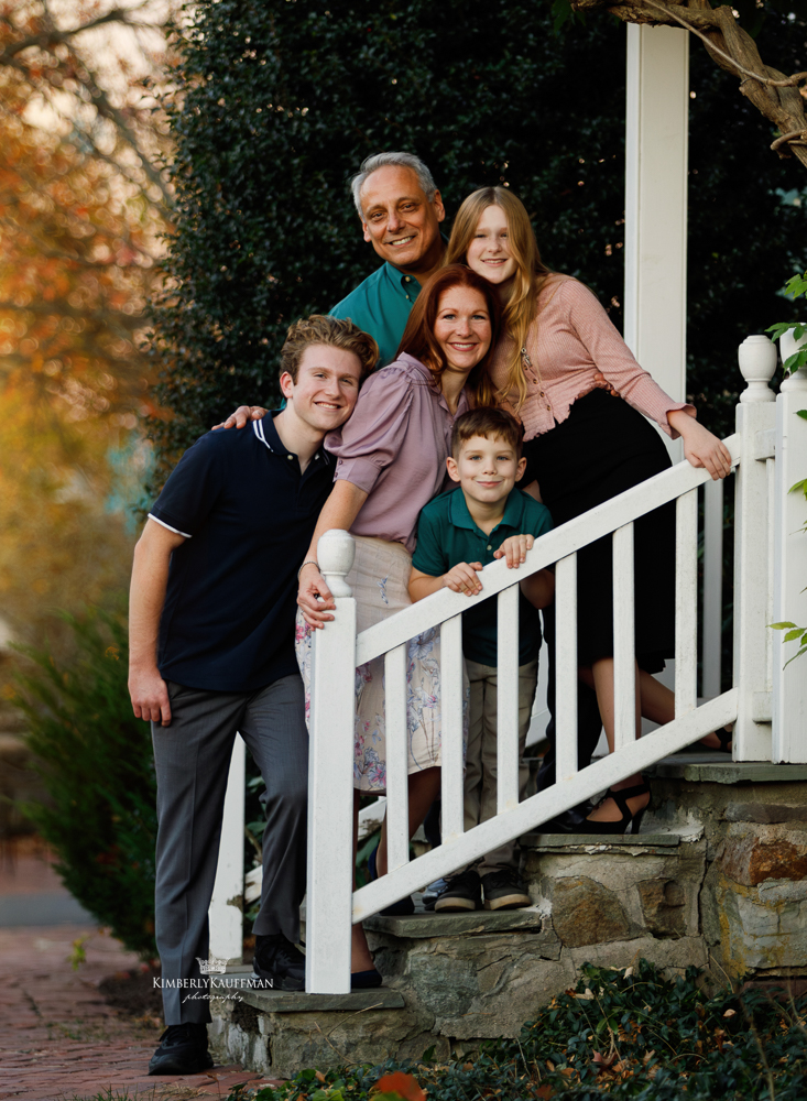 Family with three children laughing during golden hour in Bucks County, PA